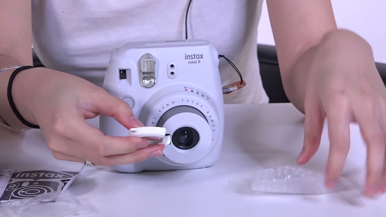 Best of How to put strap on polaroid camera