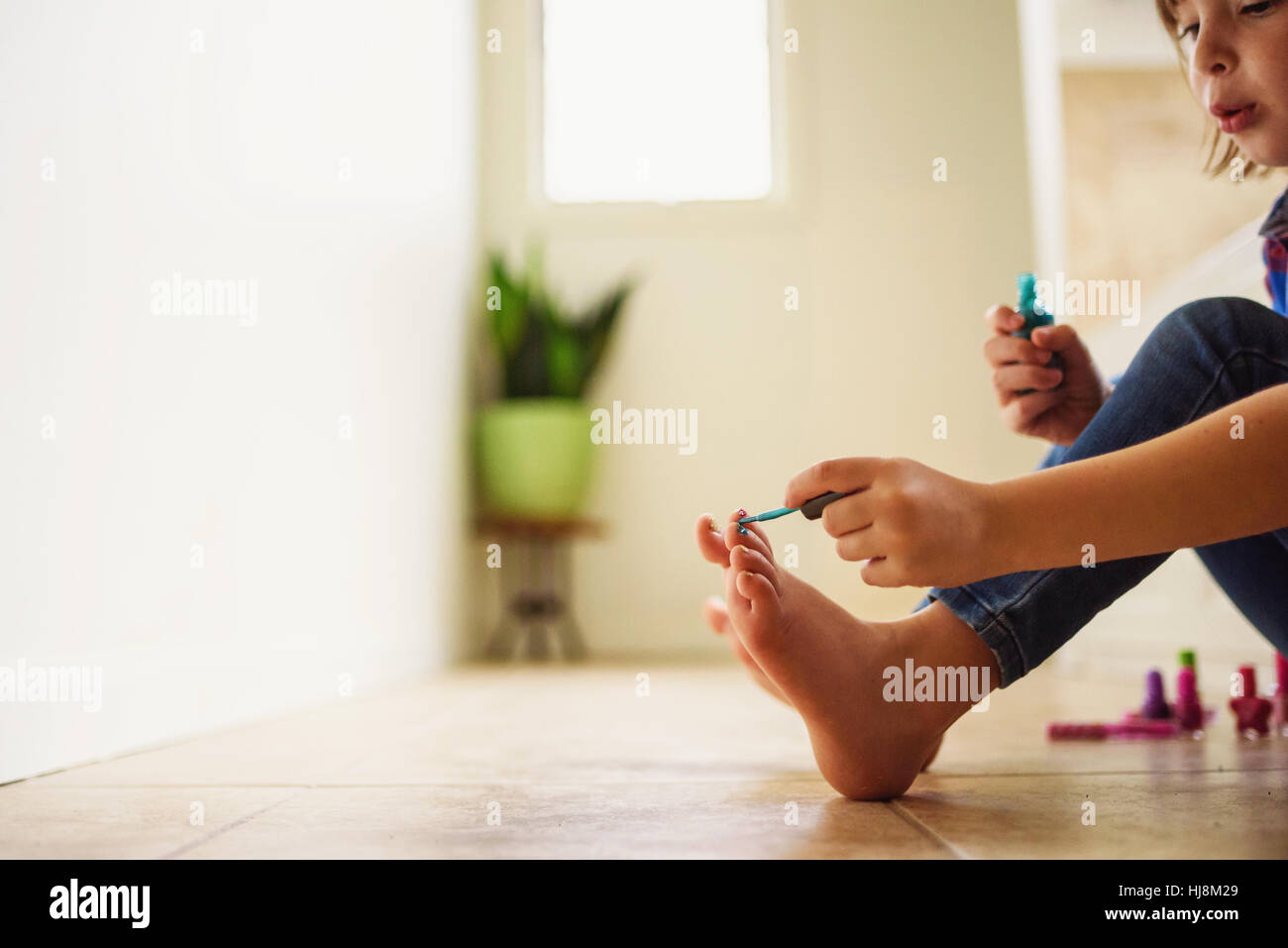 anshul maini add scene painting her toenails photo